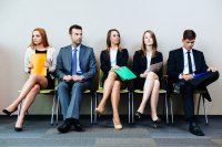 Row of male and female job seekers