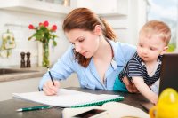 Adult female student with baby on lap 