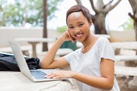 Smiling woman with laptop