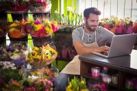 Professional Florist surrounded by blooms