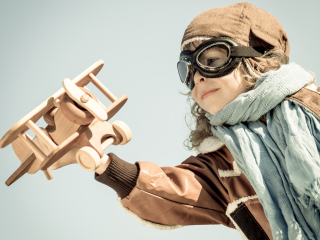 Young child with model airplane